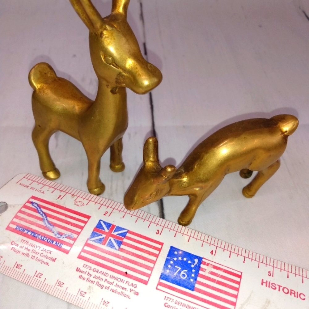 Two small brass donkeys